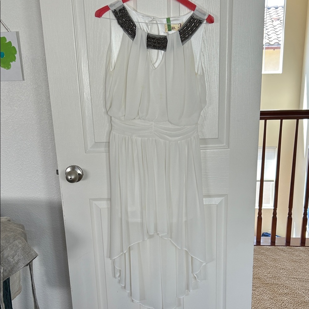 Elegant White Sleeveless Dress with Black Beaded Neckline